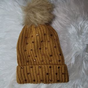 Tan rhinestone beanie with faux fur pom pom